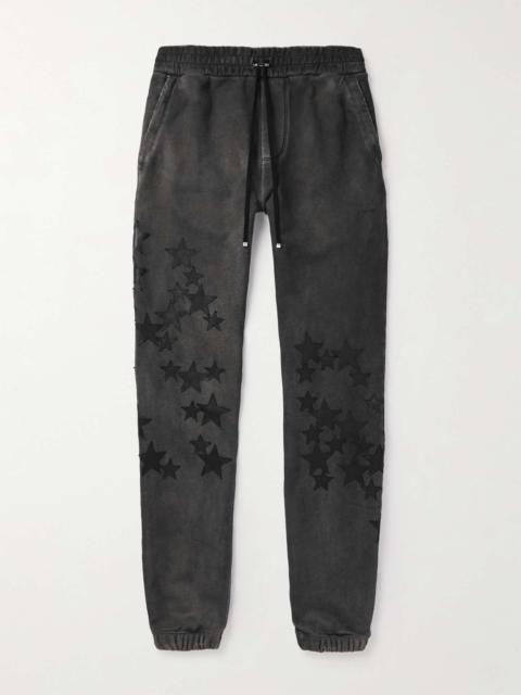 AMIRI Pigment Spray Star Tapered Leather-Trimmed Cotton-Jersey Sweatpants