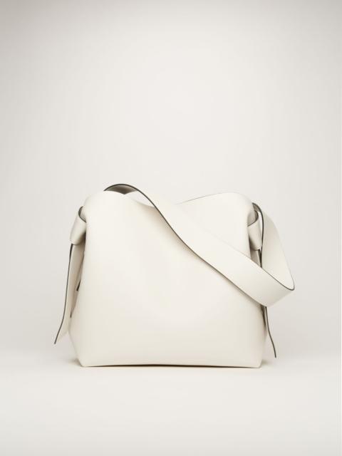 Acne Studios Medium leather bag white/black