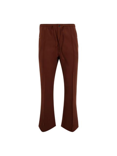 NEEDLES embroidered track pants