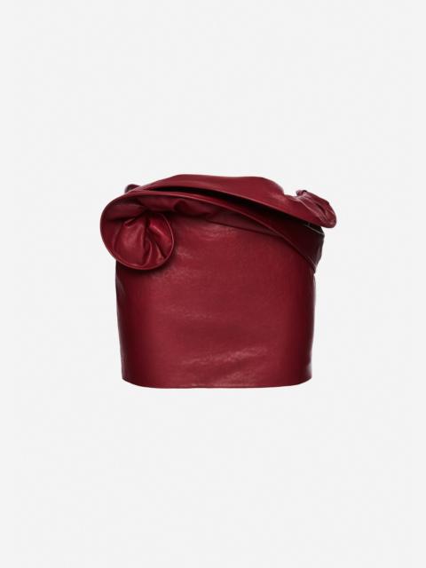 MAGDA BUTRYM Mini leather skirt with hand-twisted flower detail in cherry red