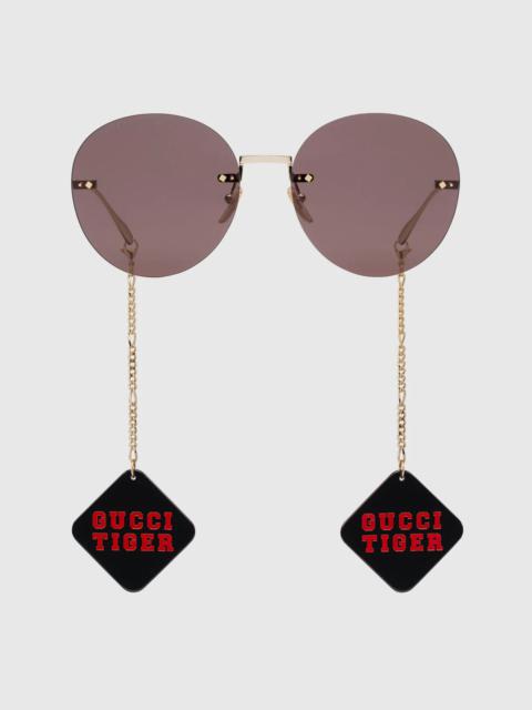 Gucci Tiger round-frame sunglasses with pendant