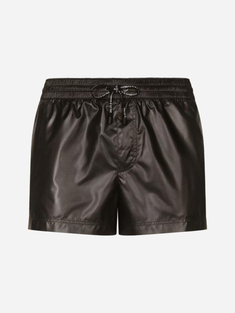 Short swim trunks with branded band