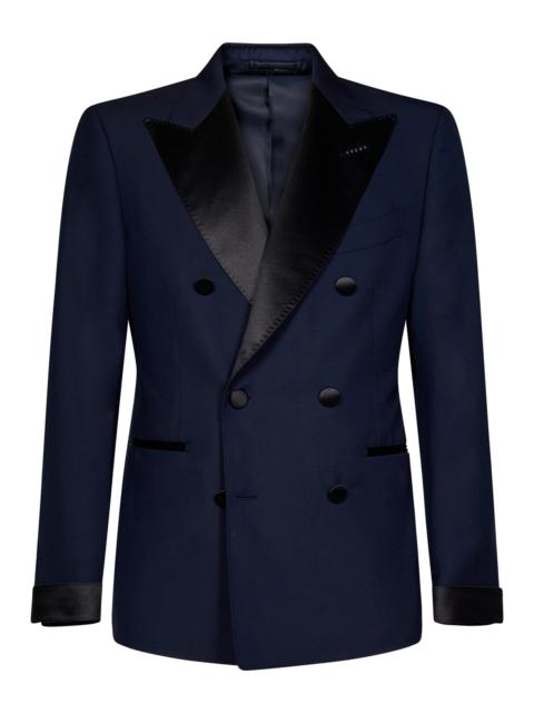 Double-breasted blazer in navy blue wool with peak lapels.