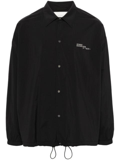 Studio Nicholson logo-print press-stud jacket