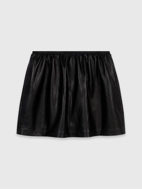 maje Short leather skirt