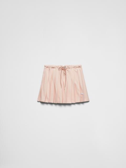 Pleated piqué miniskirt