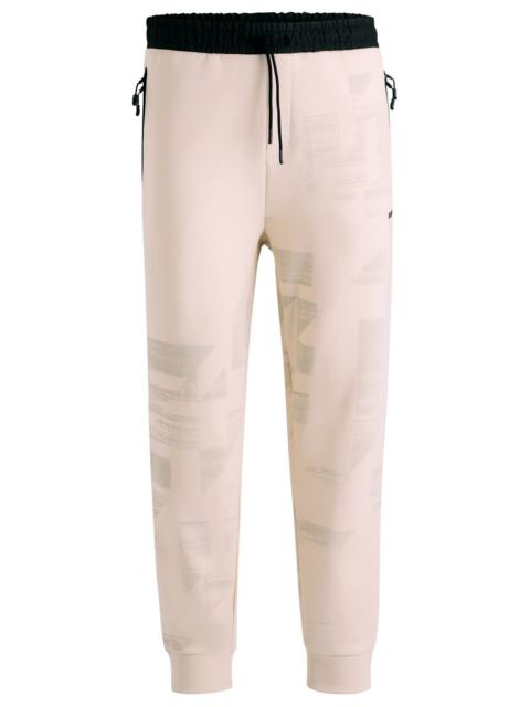 BOSS TRACKSUIT BOTTOMS WITH SEASONAL ARTWORK