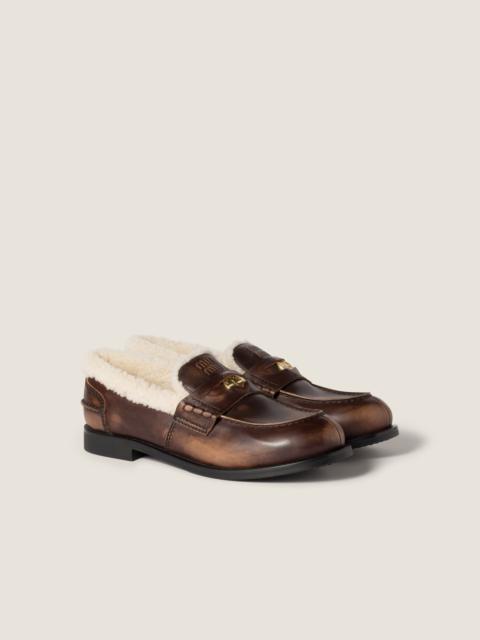 Miu Miu Bleached leather and shearling penny loafers