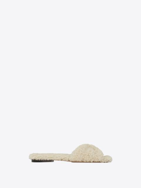 SAINT LAURENT tribute flat mules in shearling