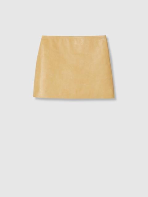 GUCCI Treated leather mini skirt