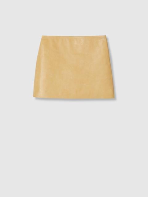 Treated leather mini skirt