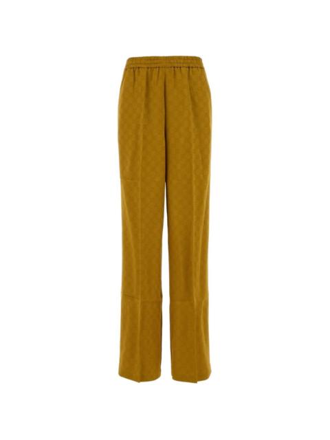 GUCCI monogram-patterned trousers