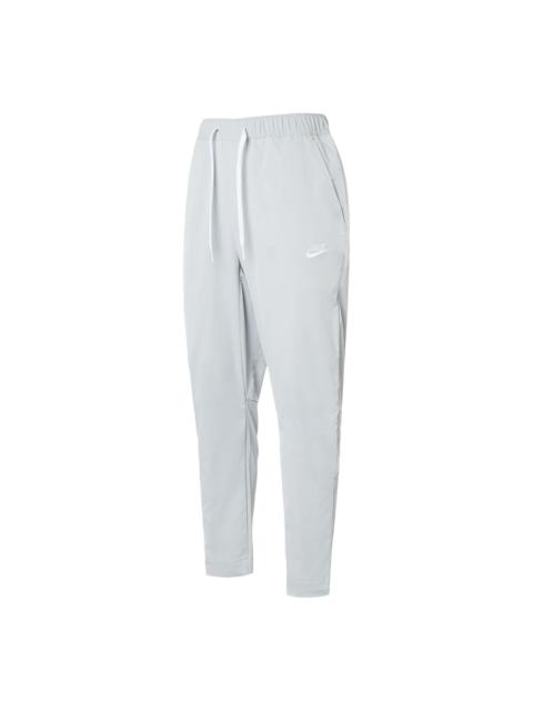 Nike Nike Club Woven Tapered Leg Pants 'Light Smoke Gray White' DX0625-077