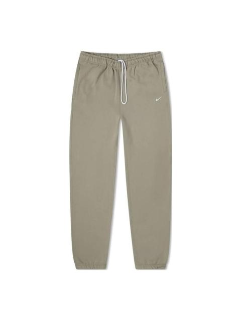 Nike Men's Nike Logo Embroidered Bundle Feet Casual Solid Color Sports Pants/Trousers/Joggers Gray CW5460