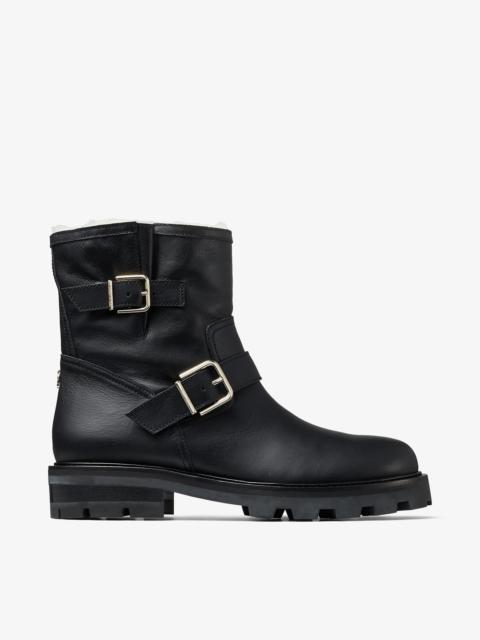 JIMMY CHOO Youth II
Black Smooth Leather Biker Boots with Gold Buckles and Shearling Lining