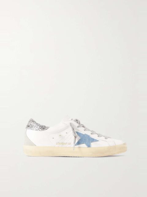 Superstar distressed denim-trimmed glittered leather sneakers