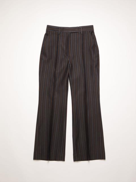 Acne Studios Flared pinstripe trousers navy/orange