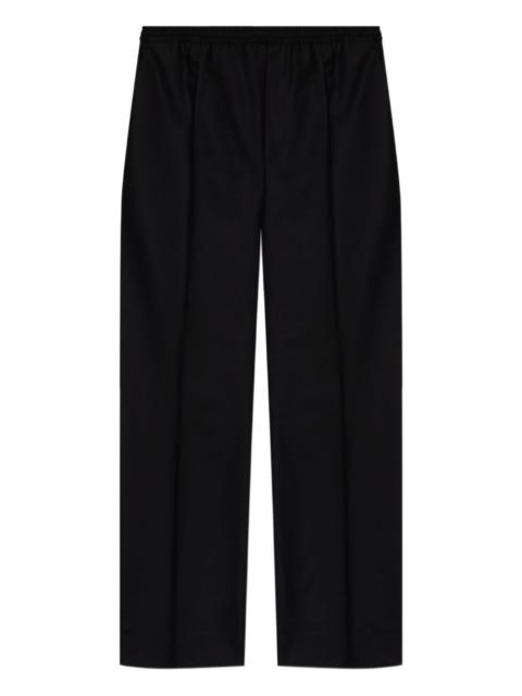 Moschino elasticated-waist gold-button trousers