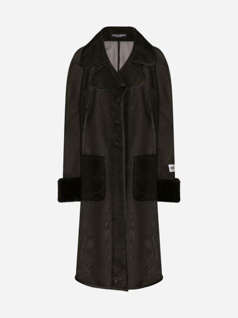 Organza trench coat with the Re-Edition label