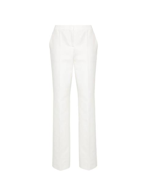 Moschino patch-detail cotton trousers