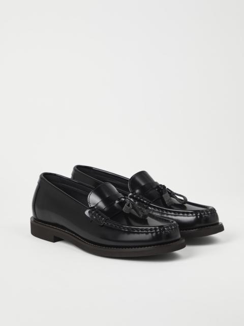 Minimal calfskin penny loafers with shiny tassels