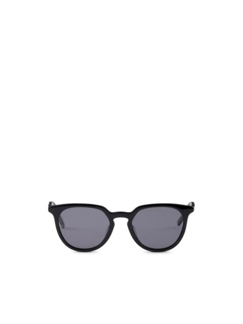 Prada sunglasses with the iconic metal plaque