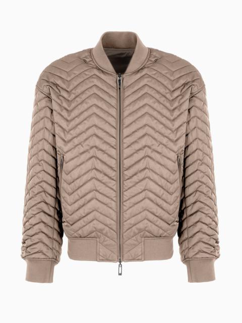 Reversible bomber jacket in quilted technical satin