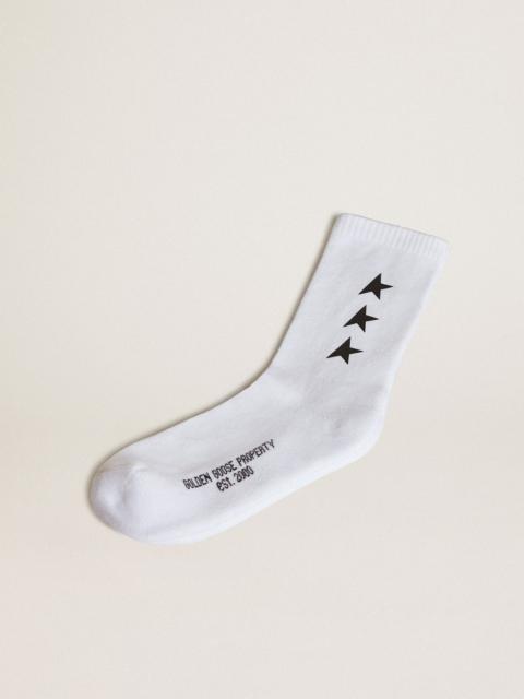 Worn white socks with contrasting black stars