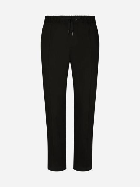 Stretch cotton jogging pants with plate