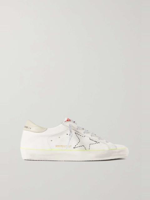 Superstar distressed embroidered textured-leather sneakers