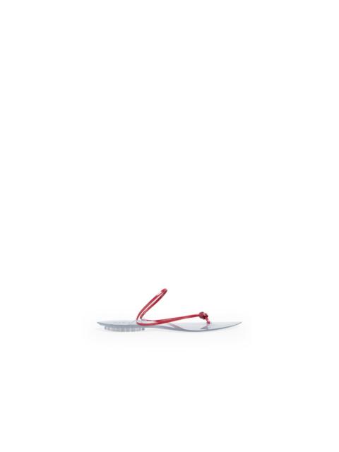 Alaïa INVISIBLE JELLY THONG IN PATENT LEATHER