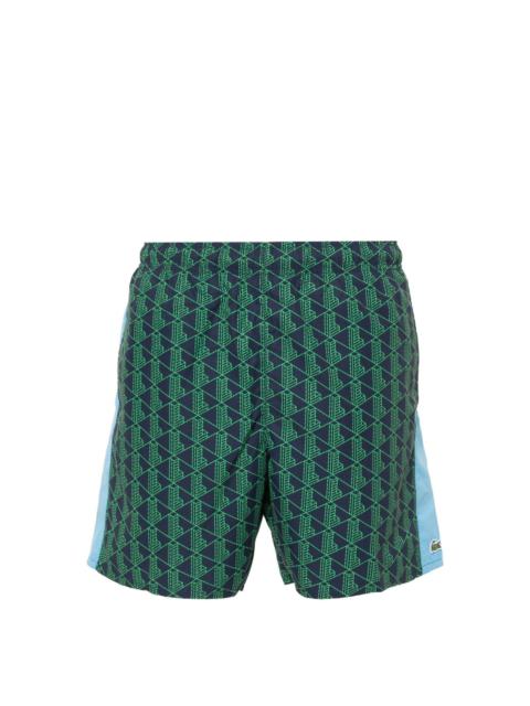 LACOSTE monogram-print swim shorts