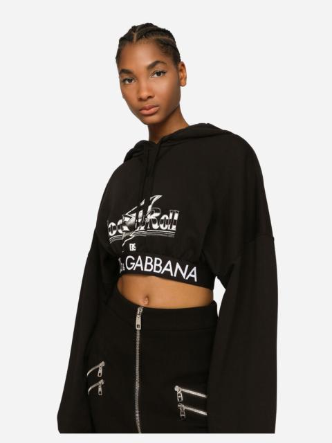 Cropped jersey hoodie with rock’n’roll print