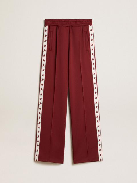 Golden Goose Women’s burgundy joggers with stars on the sides
