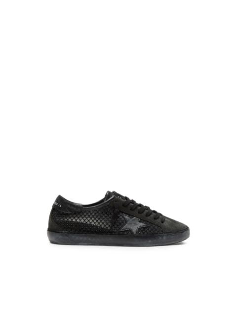 Golden Goose Super-Star LTD in perforated black suede with black star and crystals