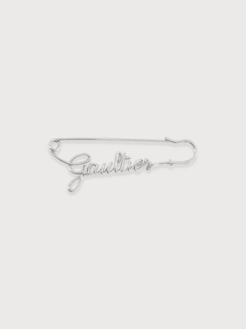 THE SILVER-TONE GAULTIER BROOCH