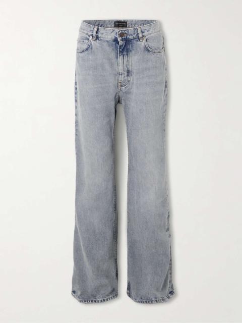 Distressed low-rise flared jeans