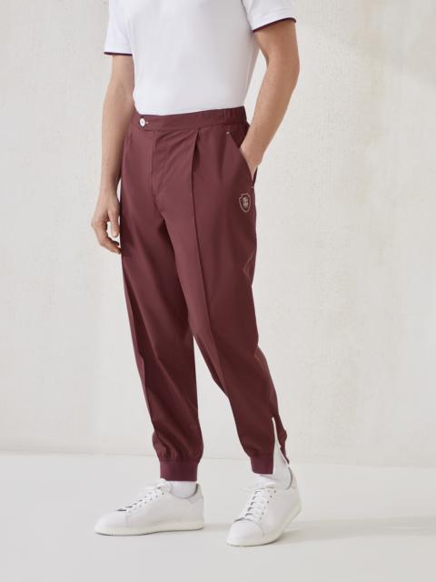 Nylon trousers with tabbed waistband, Crête detail and elasticated zipper cuffs