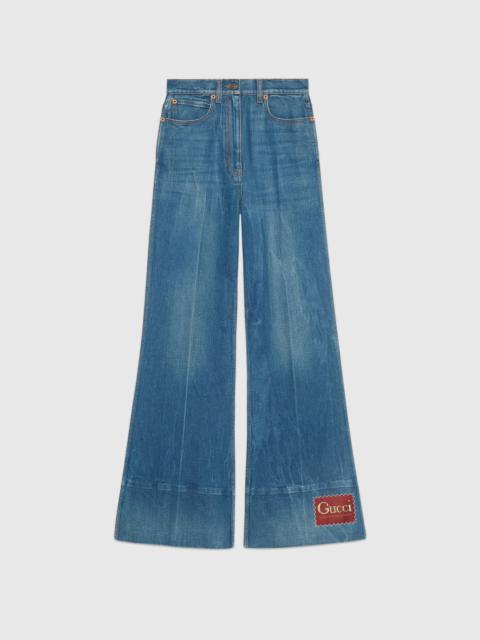 GUCCI Washed denim flare pant with Gucci label