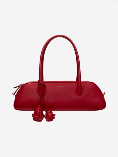 MAGDA BUTRYM Brigitte trapeze in red leather with flower charm