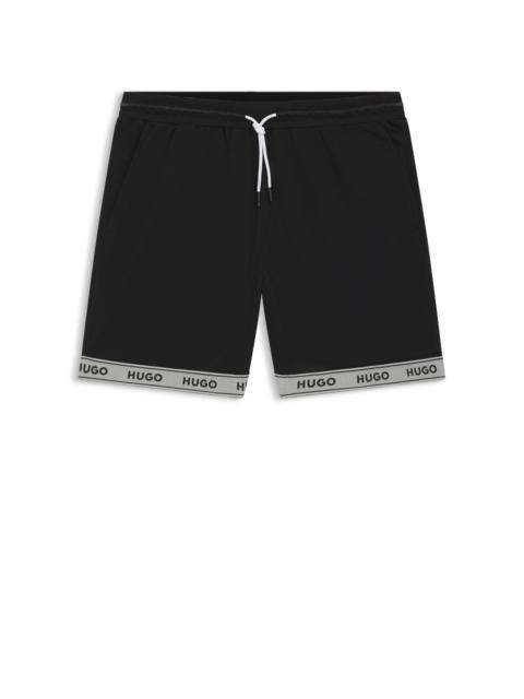 HUGO MESH SWIM SHORTS WITH JACQUARD LOGO TAPE