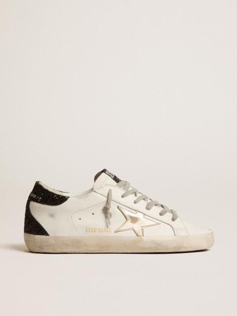 Golden Goose Super-Star with gold star and black glitter heel tab