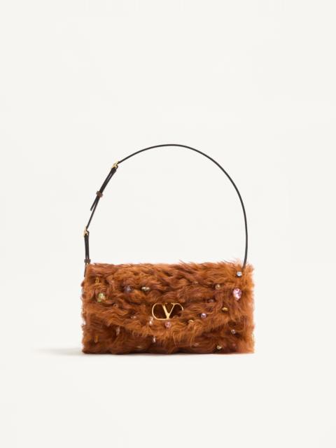 Valentino VALENTINO GARAVANI DEVAIN SMALL SHOULDER BAG IN LAMB FUR WITH RHINESTONES.
