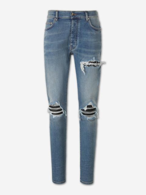 AMIRI RIPPED SLIM JEANS