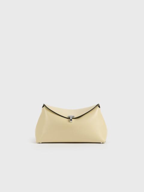 TOTEME T-lock leather clutch champagne