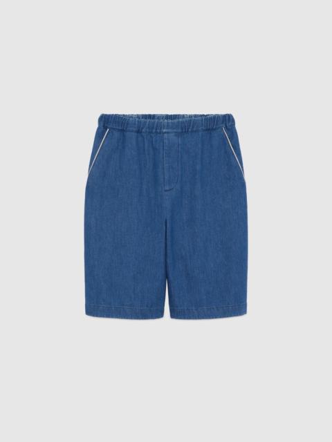 GUCCI Denim shorts with G Gucci patch
