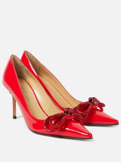 85 bow-detail patent leather pumps