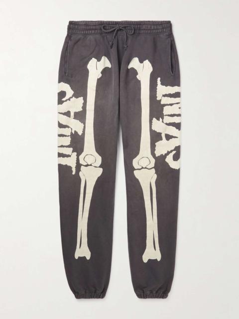 SAINT M×××××× Tapered Distressed Printed Cotton-Jersey Sweatpants