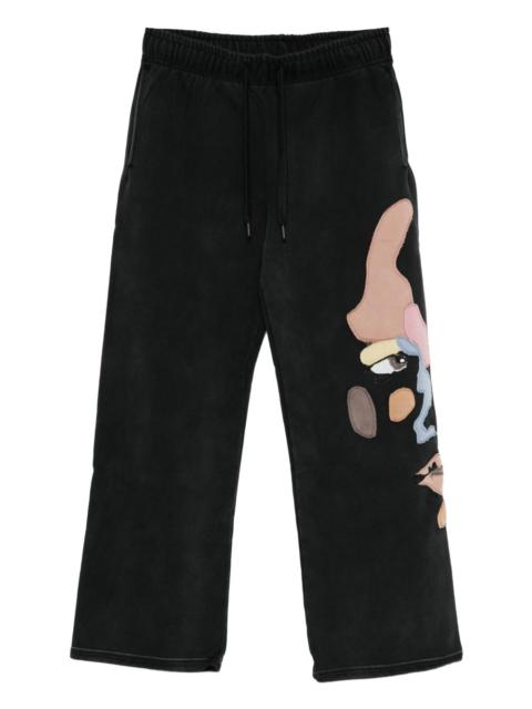 KidSuper motif-appliqué trousers