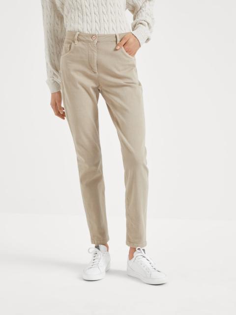 Brunello Cucinelli Stretch dyed denim slim trousers with shiny leather tab